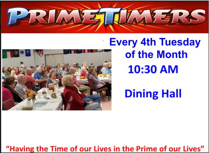 A group of people sitting at tables with food.