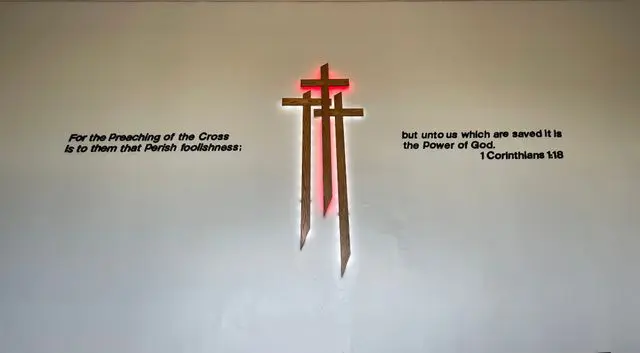 A cross with the words " king of the cross " written underneath it.